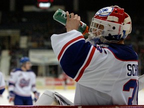 Regina Pats goalie Nick Schneider (#35) takes a drink during a game held at the Brandt Centre in Regina, Sask. on Wednesday, Jan. 1, 2014.