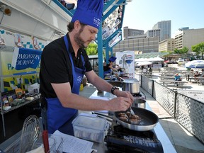 Phil Wilson competes in the food truck entree contest at the Atco Blue Flame Kitchen Stage at A Taste of Edmonton on Sunday, July 22, 2012.
Photo by John Lucas/Edmonton Journal
