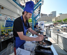 Phil Wilson competes in the food truck entree contest at the Atco Blue Flame Kitchen Stage at A Taste of Edmonton on Sunday, July 22, 2012.
Photo by John Lucas/Edmonton Journal