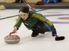 Kelsey Rocque practises her delivery with her University of Alberta team at the Saville Community Sports Centre prior to competing in the Canadian junior women's curling championship at Liverpool, N.S.