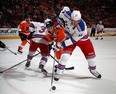 Taylor Pyatt battles with Philadelphia's Vincent Lecavalier for the puck.