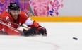 Canada's Shea Weber grimaces as he falls during the Men's Ice Hockey Semifinal match between the USA and Canada at the Bolshoy Ice Dome during the Sochi Winter Olympics on February 21, 2014.