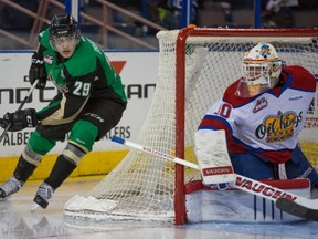 Prince Albert Raiders centre Leon Draisaitl looks for a possible wrap-around attempt against Oil Kings goaltender Tristan Jarry in Game 2 of a first-round Western Hockey League playoff series at Rexall Place on March 23, 2014.
