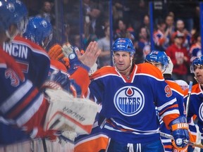 EDMONTON, AB - MARCH 06: Ryan Smyth #94 (L) of the Edmonton Oilers celebrates scoring his team's first goal against the New York Islanders during an NHL game at Rexall Place on March 06, 2014 in Edmonton, Alberta, Canada. The Oilers defeated the Islanders 3-2 in overtime. (Photo by Derek Leung/Getty Images)