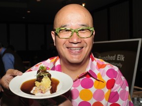 Wild Tangerine's Wilson Wu poses for a photo with Amberlane Farm Elk Meat ball stuffed with pecorino cheese, served with chickpea puree' and spicy hazelnut at the 2011 Indulgence Food and Wine Tasting event at the Delta Edmonton South.
Edmonton Journal Files