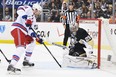 Pittsburgh Penguins goaltender Marc-Andre Fleury makes a pad save on a shot from Rick Nash of the New York Rangers in Game 2 of a second-round NHL playoff series on May 4, 2014, at Consol Energy Center in Pittsburgh.