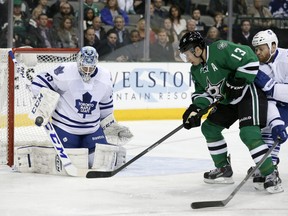 Toronto Maple Leafs goalie Jonathan Bernier blocks a shot from Dallas Stars' Ray Whitney during a National Hockey League game in Dallas on Jan. 23, 2014.