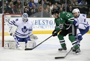 Toronto Maple Leafs goalie Jonathan Bernier blocks a shot from Dallas Stars' Ray Whitney during a National Hockey League game in Dallas on Jan. 23, 2014.