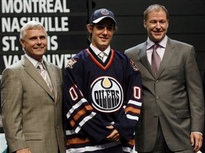 Kevin Prendergast and Kevin Lowe flank Sam Gagner, the first of the three 1st round picks by the Edmonton Oilers in 2007.