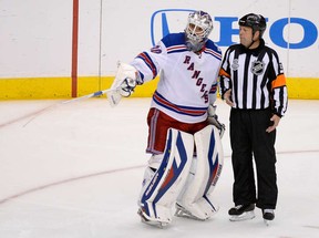 New York Rangers goalie Henrik Lundqvist pleads his case, unsuccessfully, with NHL referee Dan O'Halloran a few minutes after Dwight King's highly suspect goal turned Game 2 towards the Los Angeles Kings.