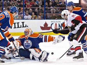 A rare picture of Justin Schultz and Jeff Petry in action together, as the two right-shooters generally play on different pairings. Ben Scrivens displays rather odd form in keeping the puck out of the net, this time.
