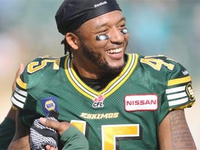 Rookie Edmonton Eskimos linebacker Dexter McCoil celebrates after a Canadian Football League game against the Toronto Argonauts at Commonwealth Stadium on Aug. 23, 2014. McCoil had two interceptions and scored two touchdowns as the Eskimos defeated the Toronto Argonauts 41-27.
Photograph by: Mack Lamoureux