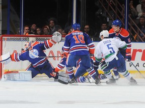 The one that got away. Radim Vrabata (out of frame at left) was left alone to pot the game winner when all the Oilers congregated on the other side of the crease.