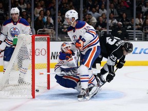Justin Schultz and Teddy Purcell are not-so-innocent bystanders as Dustin Brown pots one of six Kings tallies behind Ben Scrivens in an ugly night for Edmonton Oilers.