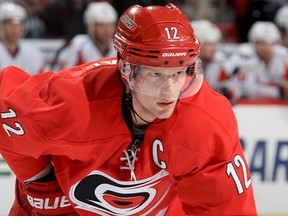 Eric Staal #12 of the Carolina Hurricanes prepares for a faceoff during their NHL game against the Washington Capitals at PNC Arena on April 10, 2014 in Raleigh, N.C. (Photo by Gregg Forwerck/Getty Images)