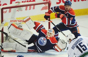 It was a night where Ben Scrivens needed help covering the top half of the net. Here Taylor Hall fills in.
