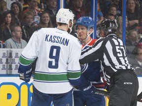 Andrew Ference and Zack Kassian exchange pleasantries.