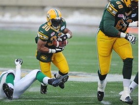 Esk RB John White hits an opening in the Rider line during the Western Semi Final game in Commonwealth Stadium in Edmonton on Sunday Nov 16, 2014.
Photograph by: John Lucas, Edmonton Journal