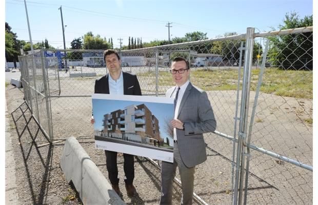 Ivan Beljan, left, and Chris Dulaba, right, partners at Beljan Development, hold an image board of a rental unit that they are planning to build along a busy transit route on 106th Avenue.