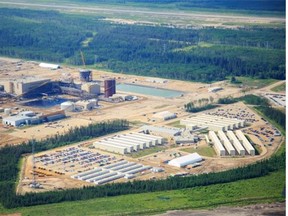An aerial view of Shell’s Jackpine oilsands mining operation, photographed in June 2013, with the 2,460 room Albian Village work camp next to it, north of Fort McMurray