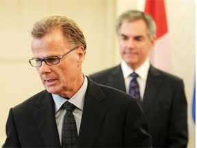 New Alberta Education Minister Gordon Dirks is sworn in during the swearing in ceremony at Government House in Edmonton on Monday Sept. 15, 2014.