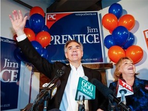 Alberta Premier Jim Prentice, left, celebrates with his wife Karen after winning a seat in the provincial legislature following a byelection in Calgary, Monday, Oct. 27, 2014.