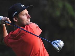 Alex Large of Stewart Creek Golf course wins in the final round at the Edmonton Men’s Amateur Golf Tournament at the Windermere Golf and Country Club in Edmonton, August 25, 2014.