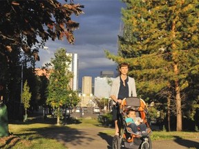 Alex Zabjek enjoys some late afternoon sunshine with her toddler son Arjun Swatch in downtown Edmonton.