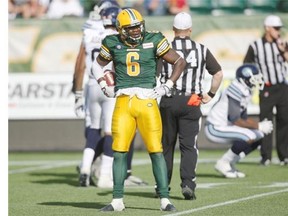 Alonzo Lawrence celebrates his last minute interception in the second half of the Toronto — Edmonton game at Commonwealth Stadium on Aug. 23, 2014.