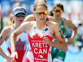 Amelie Kretz runs in the Elite Women race during the 2013 Edmonton ITU Triathlon World Cup at Hawrelak Park in June 2013.