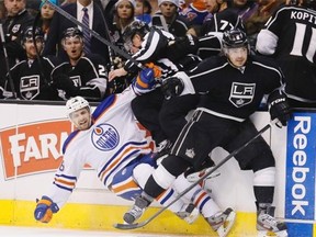 Los Angeles Kings’ Drew Doughty, right, checks Edmonton Oilers’ Mark Arcobello during an NHL  game in 2013. The Kings won 3-0.
