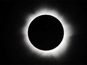 An annular solar eclipse is viewed from Australia in November 2012. In an annular eclipse,  the moon covers all but a bright ring around it.