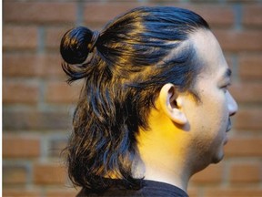 Ariel del Rosario of Edmonton wears his hair in a top knot or "man bun."