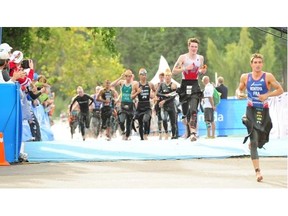 Athletes compete in the junior men’s race at the World Triathlon Series Grand Final at Hawrelak Park in Edmonton on Friday, Aug. 29, 2014.