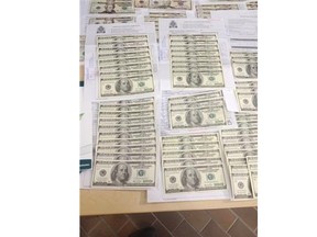 Det. Bill Allen with the Edmonton Police Service’s economic crimes section is warning retailers to be vigilant after a recent influx of U.S. counterfeit currency.