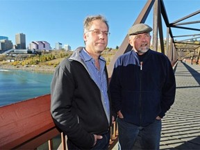 Bill Moore-Kilgannon, left, president of the Riverdale Community League, and Paul Bunner, civics director for the Cloverdale Community League, on the Cloverdale footbridge where the new LRT will be crossing the river. Many community groups are frustrated at the lack of detail in the request for proposals for the Valley Line LRT.