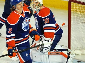 The body language of Edmonton Oilers goalie Ben Scrivens and defenceman Jeff Petry says it all after the Chicago Blackhawks scored their first of seven goals in Saturday’s NHL game at Rexall Place.
