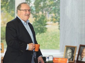Brian Mason has pictures of Jack Layton and Tommy Douglas on his desk.