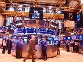 The floor of the New York Stock Exchange at the closing bell Oct. 29, 2014, in New York City. The Federal Reserve phased out its bond purchasing program while keeping interest rates near zero for a “considerable time.”