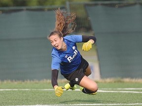 Canada’s U-20 Women’s World Cup goalkeeper Kailen Sheridan dives to make a save during Thursday’s practice at the Edmonton Soccer Complex.