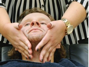 Canadian Finals Rodeo cowboy Brett Monea prepares to get a shave at West Edmonton Mall Saturday November 1, 2014 in support of “Movember”, a moustache-growing charity event held during November each year that raises funds and awareness for men’s health.