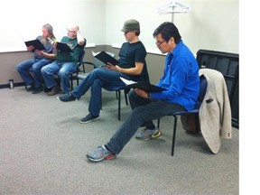 Voice teacher Eva Bostrand, right, leads the Edmonton Downtown Men’s Choir through a new song Saturday at the Stanley A. Milner Library.