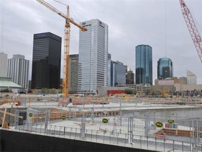 Edmonton should pay for more major projects with taxes because debt servicing costs will nearly double over the next decade, an economist says.
