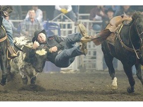 Clayton Moore competes in steer wrestling event in the Canadian Finals Rodeo’s final go-round Sunday at Rexall Place.