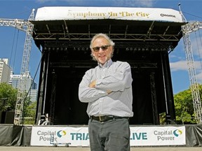 Conductor Bob Bernhardt stands in front of the stage in Churchill Square where the Edmonton Symphony Orchestra will stage an event called Symphony in the City on Labour Day weekend.