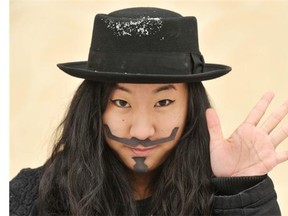 Connie Le wears her “Guy Fawkes” moustache. The University of Alberta medical student creates and wears fake moustaches to support Movember.