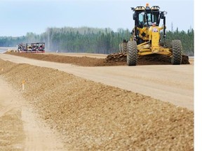 Crews work on the twinning of Highway 63 about 60 kilometres north of Wandering River in 2012. (Edmonton Journal/File)