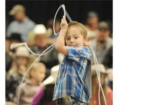 Cruz Lillico takes part in the 5 and under Boys category during the Kids Dummy Roping Competition in the Expo Centre in Edmonton on Friday Nov 7, 2014.