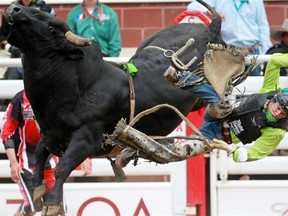 Dakota Buttar of Kindersley, Sask.,competes in the bull riding on Day 1 of the 2014 Calgary Stampede rodeo on July 4, 2014.