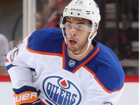 Darnell Nurse #25 of the Edmonton Oilers skates with the puck during the NHL game against the Arizona Coyotes at Gila River Arena on October 15, 2014 in Glendale, Arizona.  The Coyotes defeated the Oilers 7-4.